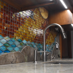 Custom mosaic artistic glass and stone backsplash