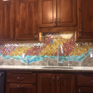 Custom mosaic artistic glass and stone backsplash