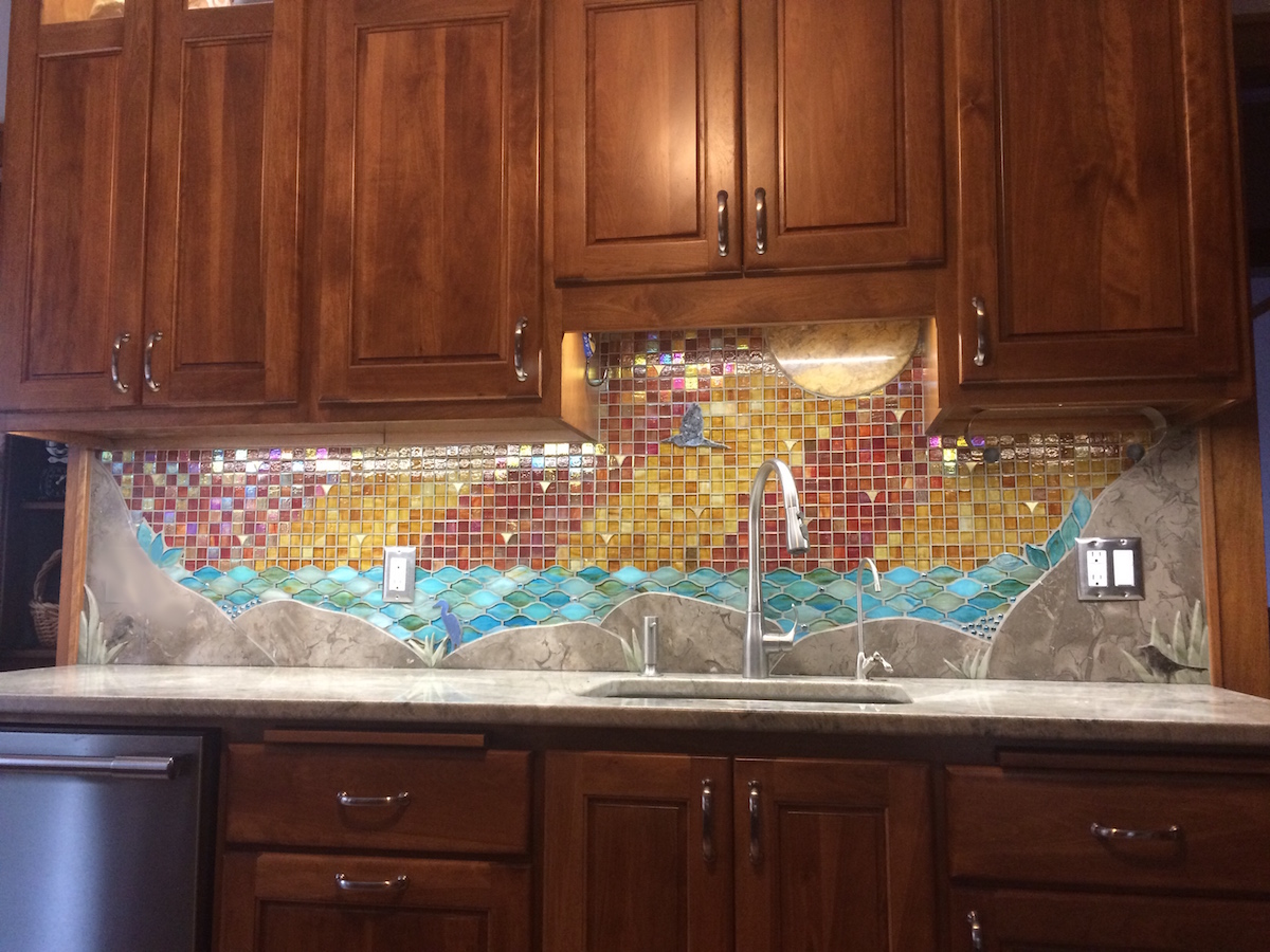 Custom mosaic artistic glass and stone backsplash