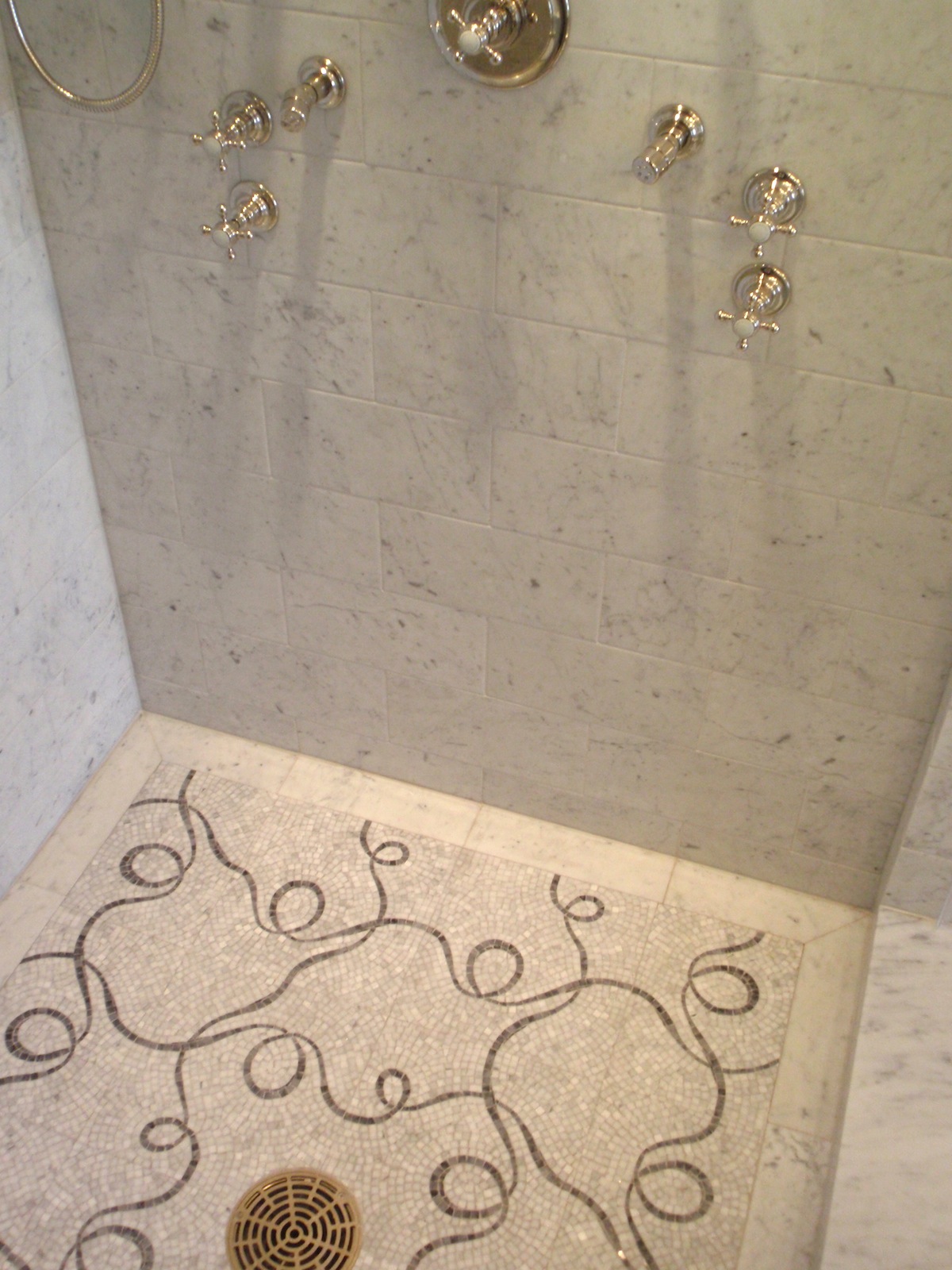 Waterworks Carrara Marble shower with carrara marble mosaic floor