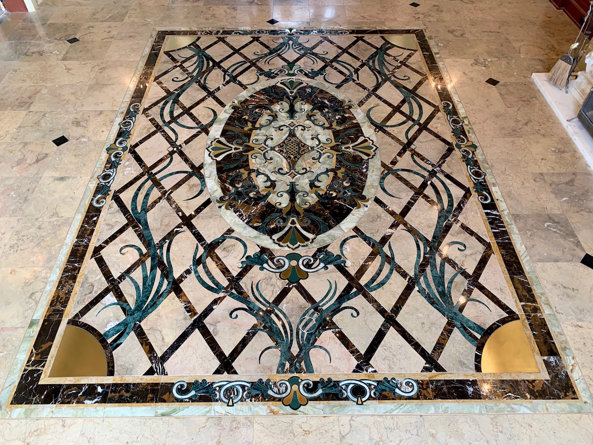 custom stone foyer medallion with brass inlays