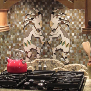 Custom kokopelli stone and tile backsplash